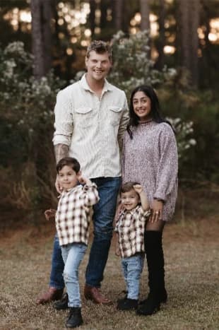A Restoration Roofing team member with his wife and two boys